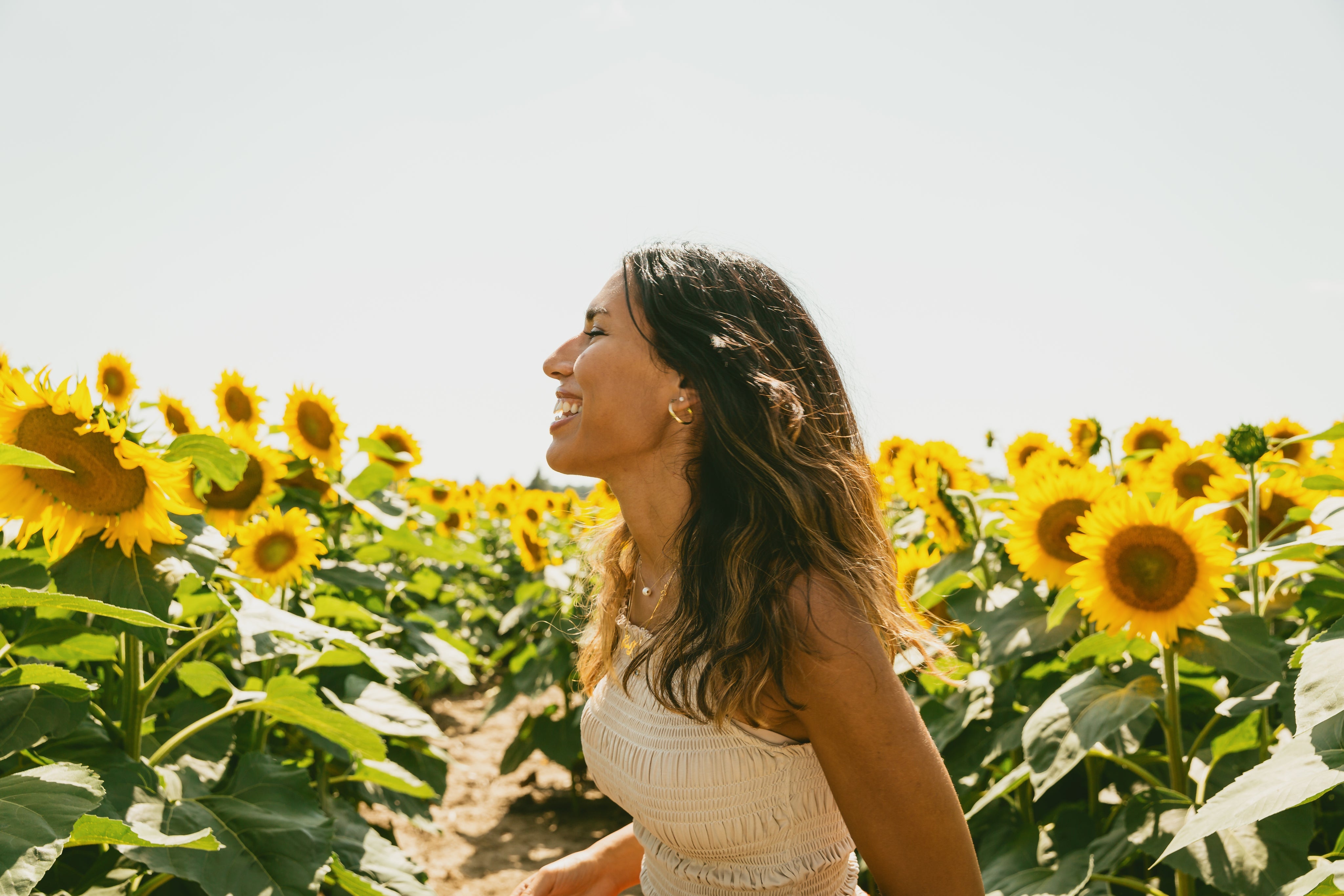 files/profile-of-a-person-smiling-in-a-sunflower-field.jpg